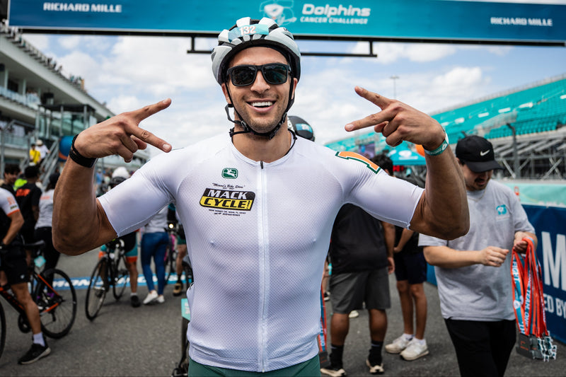 mack hollins at the dcc xv riding for team hurricanes - mack cycle at the finish line of the 100 mile ride 
