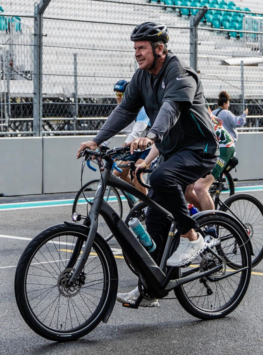 Dan Marino riding a bike from Mack Cycle during the Dolphin's Challenge Cancer 2024. The bike is the Specialized Turbo Como 4.0 650b Electric Bike